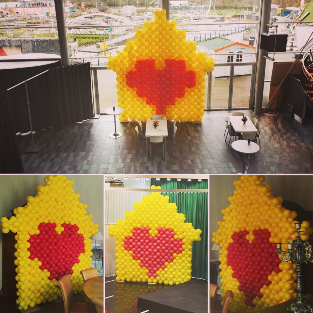 De Ballonnenkoning - ballonwand of ballonmuur - geel rood - huisje