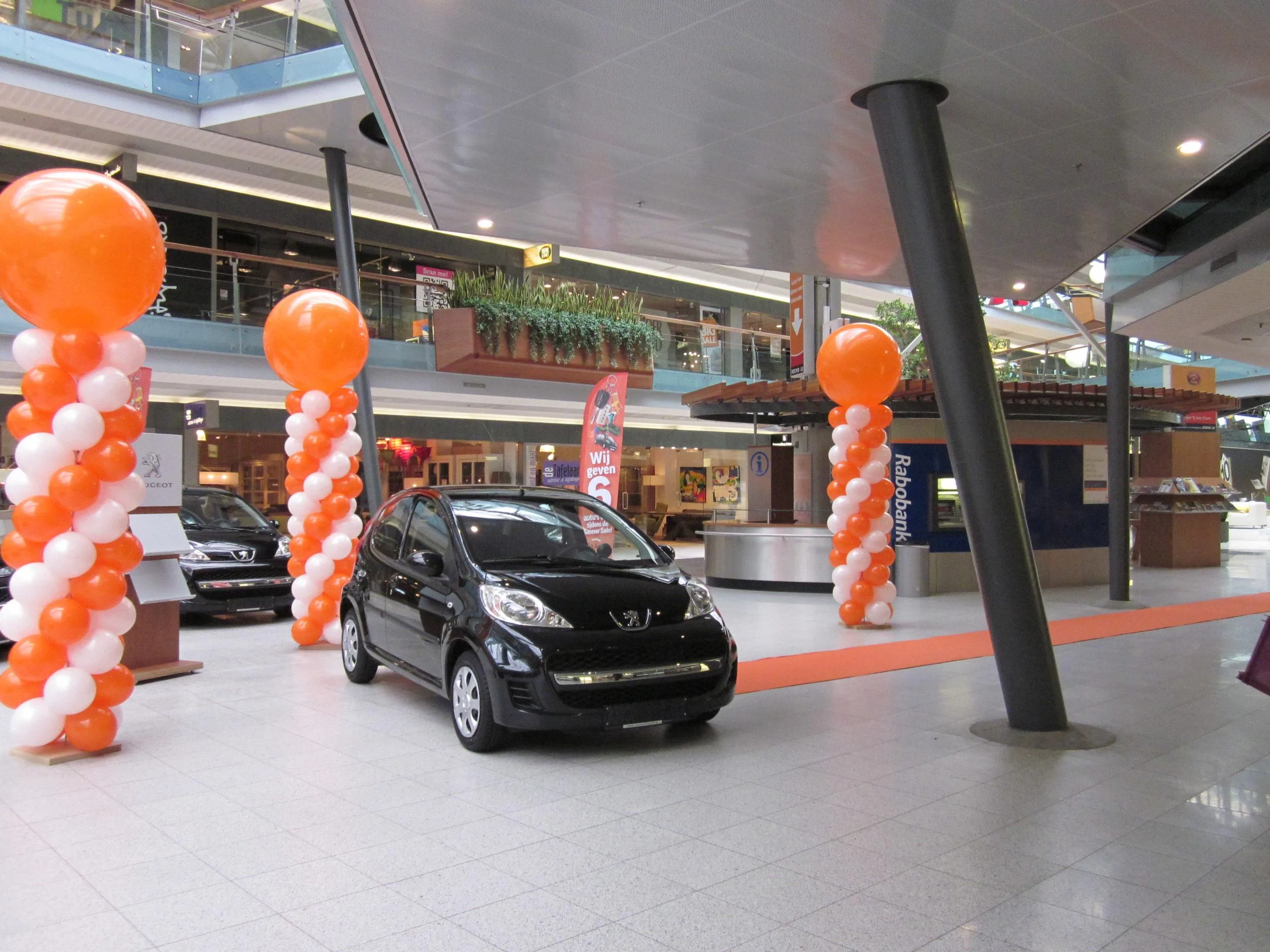 De Ballonnenkoning - ballonpilaren - wit oranje - oranje topballon