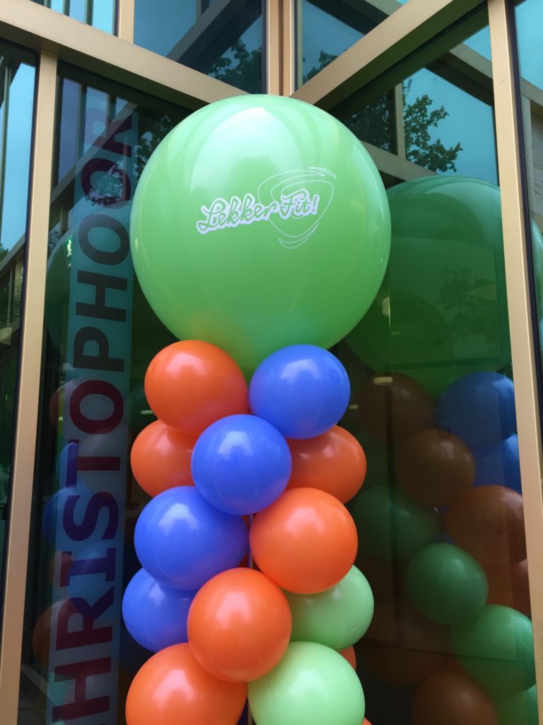 De Ballonnenkoning - ballonpilaar - oranje blauw groen - groen bedrukte topballon